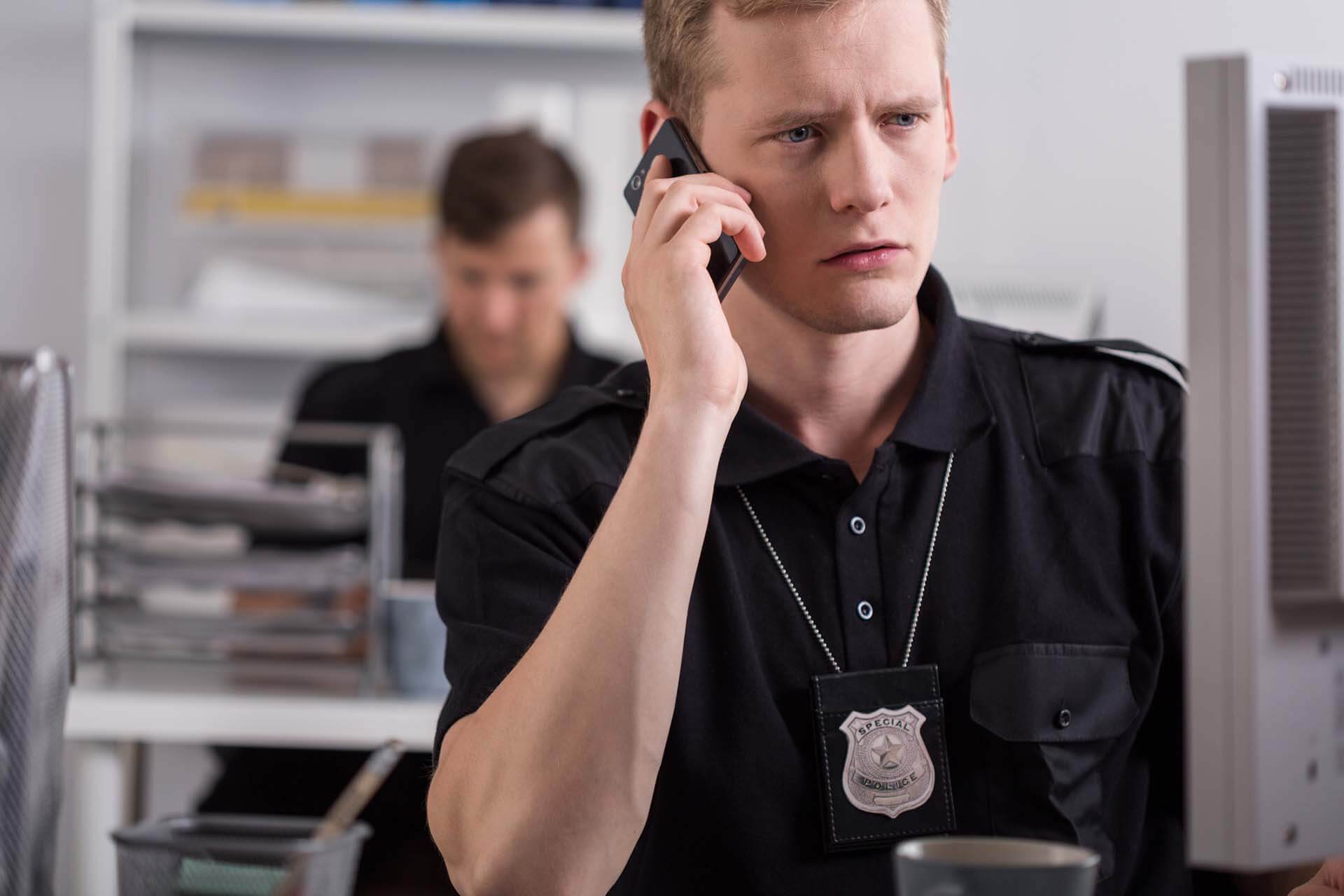 A Police Officer Talking Over Phone