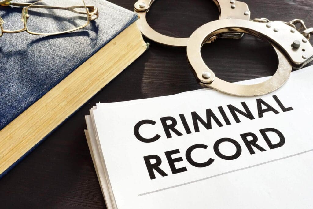 Criminal Record Paper, Handcuffs & Book