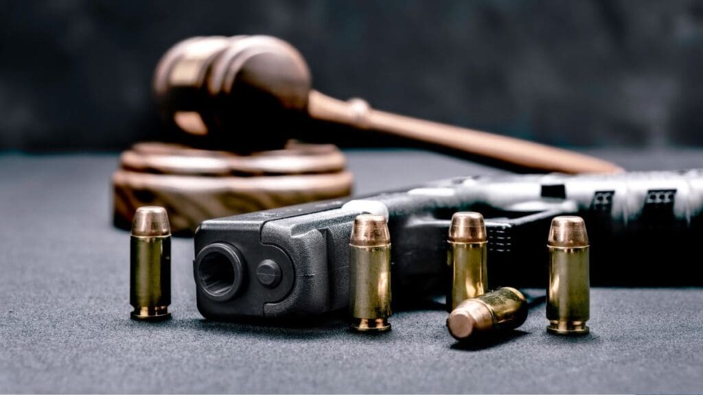 Gun And Bullets On A Table